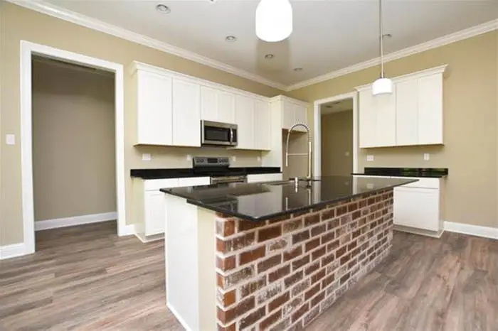 Kitchen island with brick in front