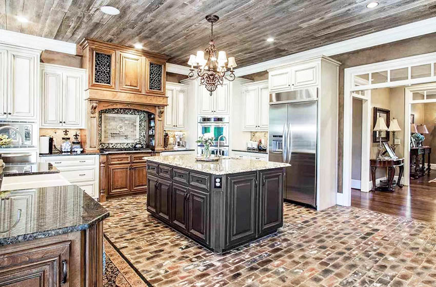 Kitchen with brick veneer flooring, antique cabinets and wood accent ceiling