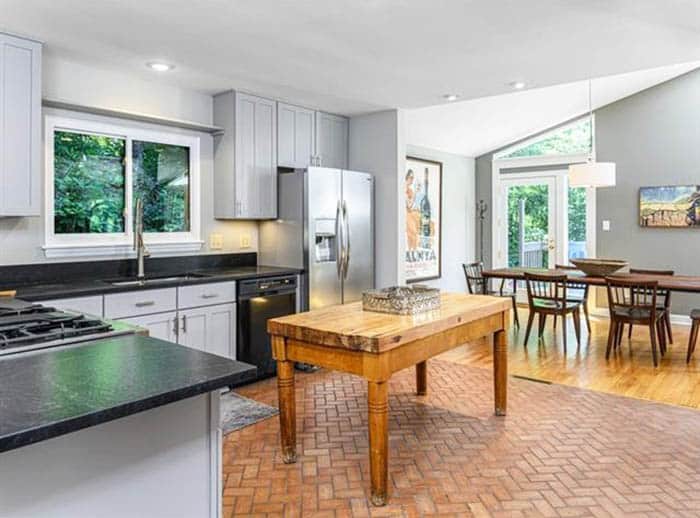 Kitchen with herringbone pattern faux brick floors