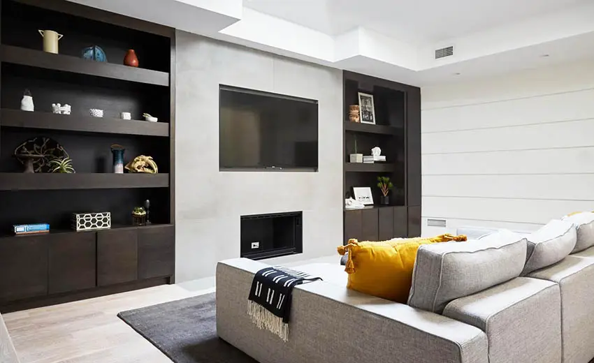 Modern basement living room with wall storage units
