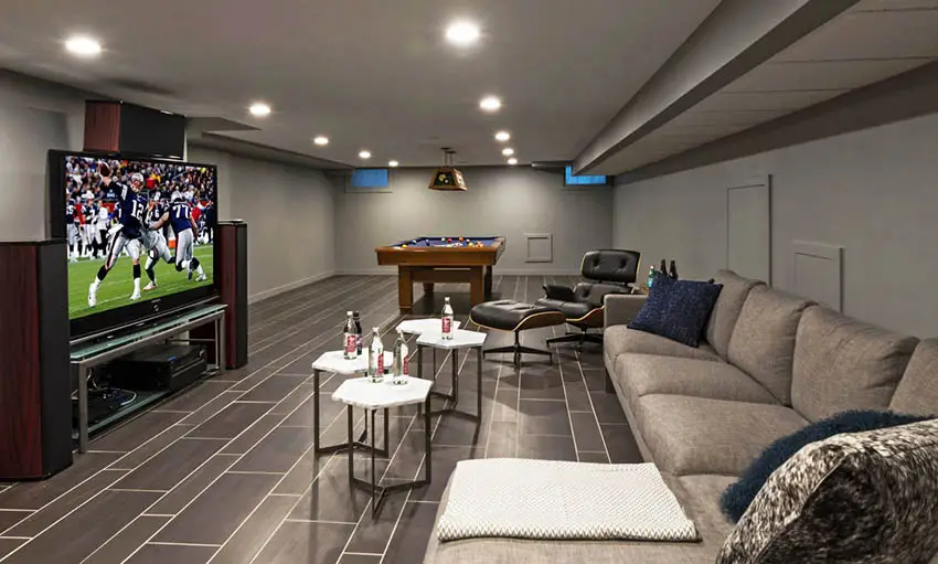 Modern basement man cave design with sectional couch