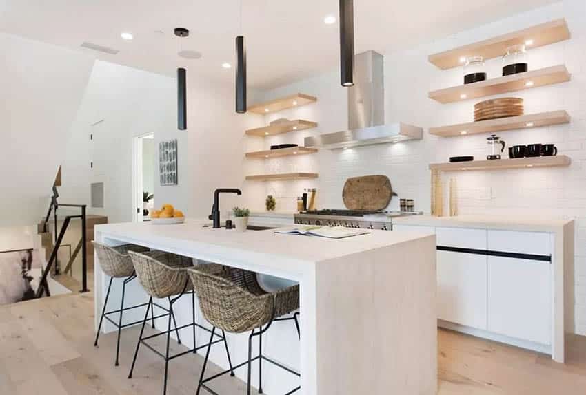 Modern kitchen with quartz waterfall countertop black pendant lights white no hardware cabinets open shelving