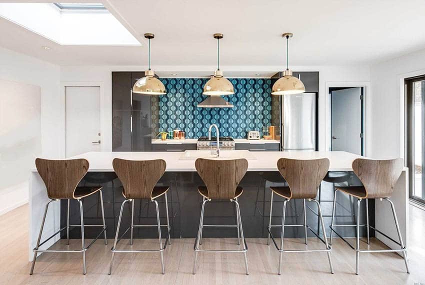 Modern kitchen with skylight and dark cabinets colorful backsplash