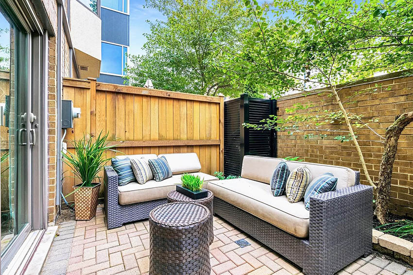 Small backyard paver patio with herringbone pattern