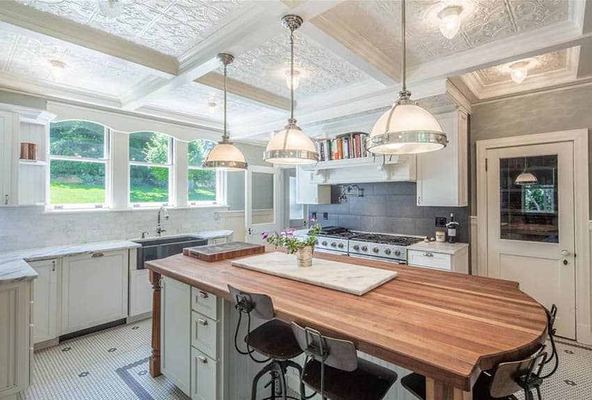 white-tin-ceiling-kitchen-with-white-cabinets-green-island-butcher-block-counter