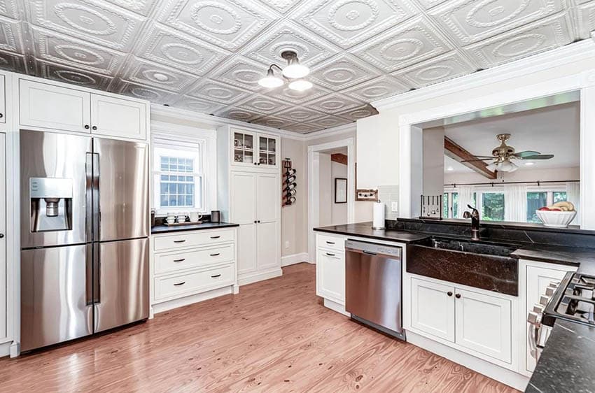 white-tin-ceiling-kitchen-with-white-cabinets-wood-flooring
