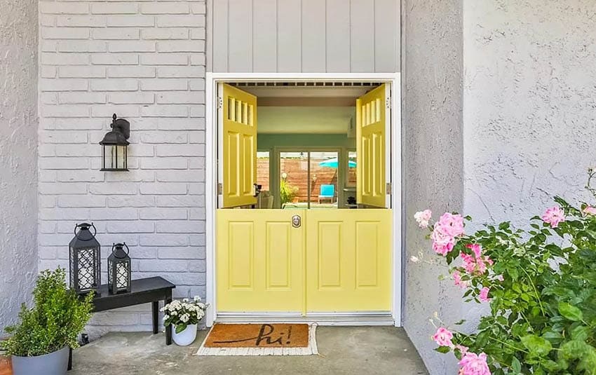 Yellow double dutch doors at front of home