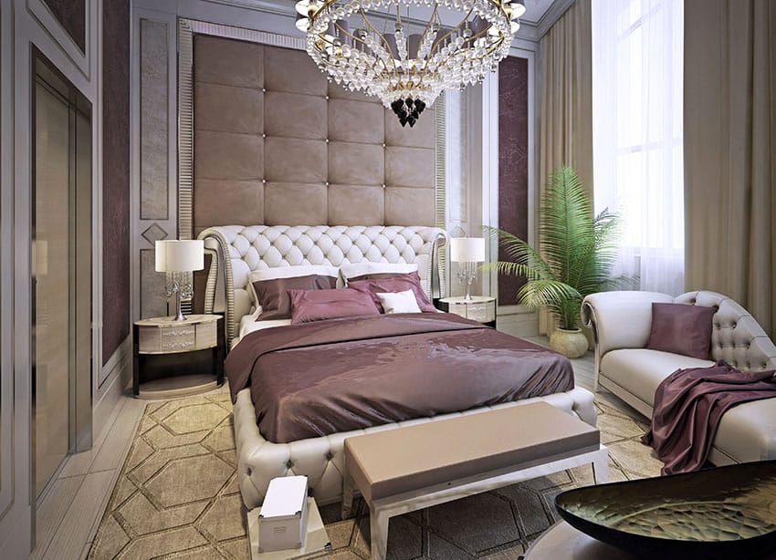 Beautifully decorated bedroom with tufted sofa and chandelier