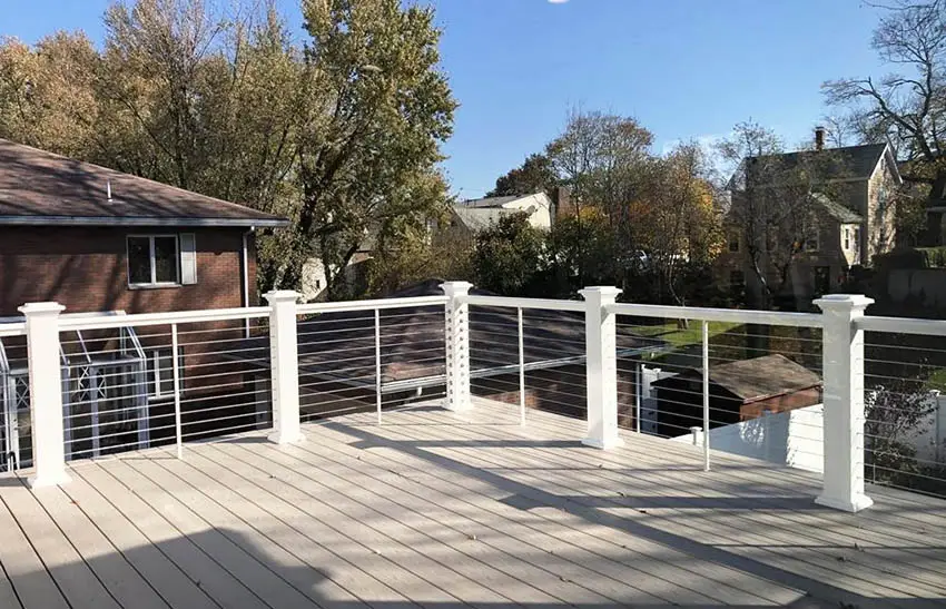 Cable deck railing with painted white posts