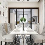 Contempoary dining room with white table, gray chairs and black area rug