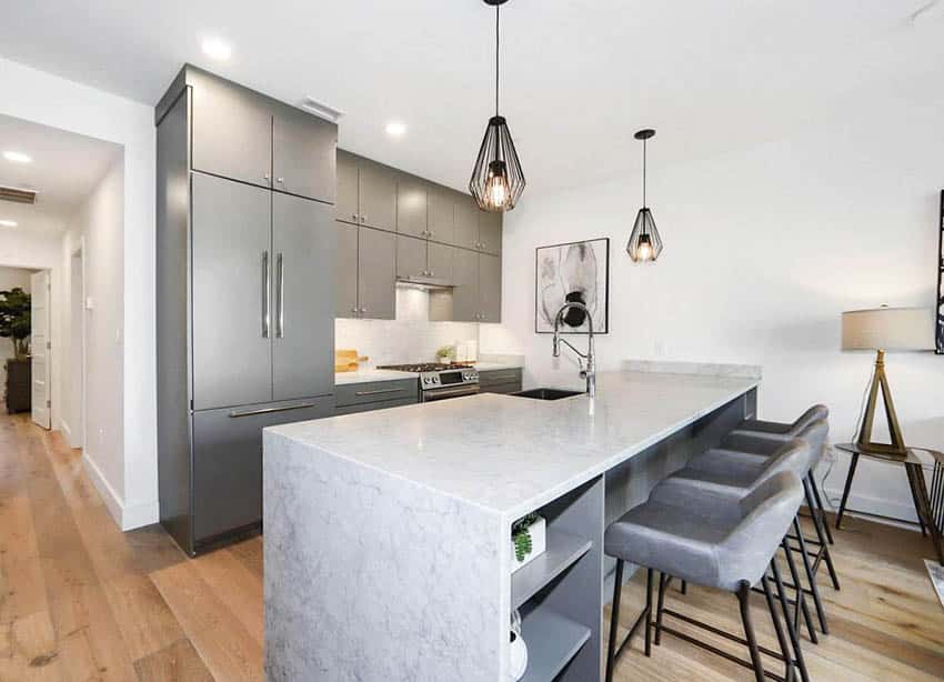 Contemporary kitchen with honed white silestone countertops dining peninsula gray cabinets