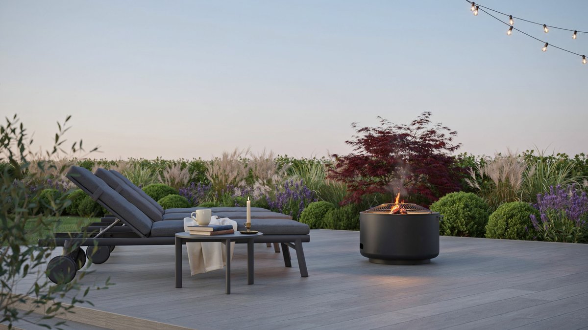 Contemporary gray deck featuring a round portable fire pit and lounge chairs