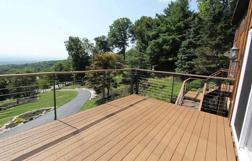 Contemporary trex deck with wood and cable railing