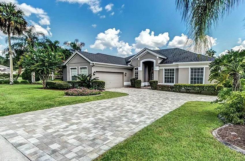 Housw with taupe paint and grey shingle roof