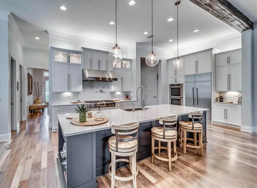 Kitchen with dark gray island and light gray cabinets