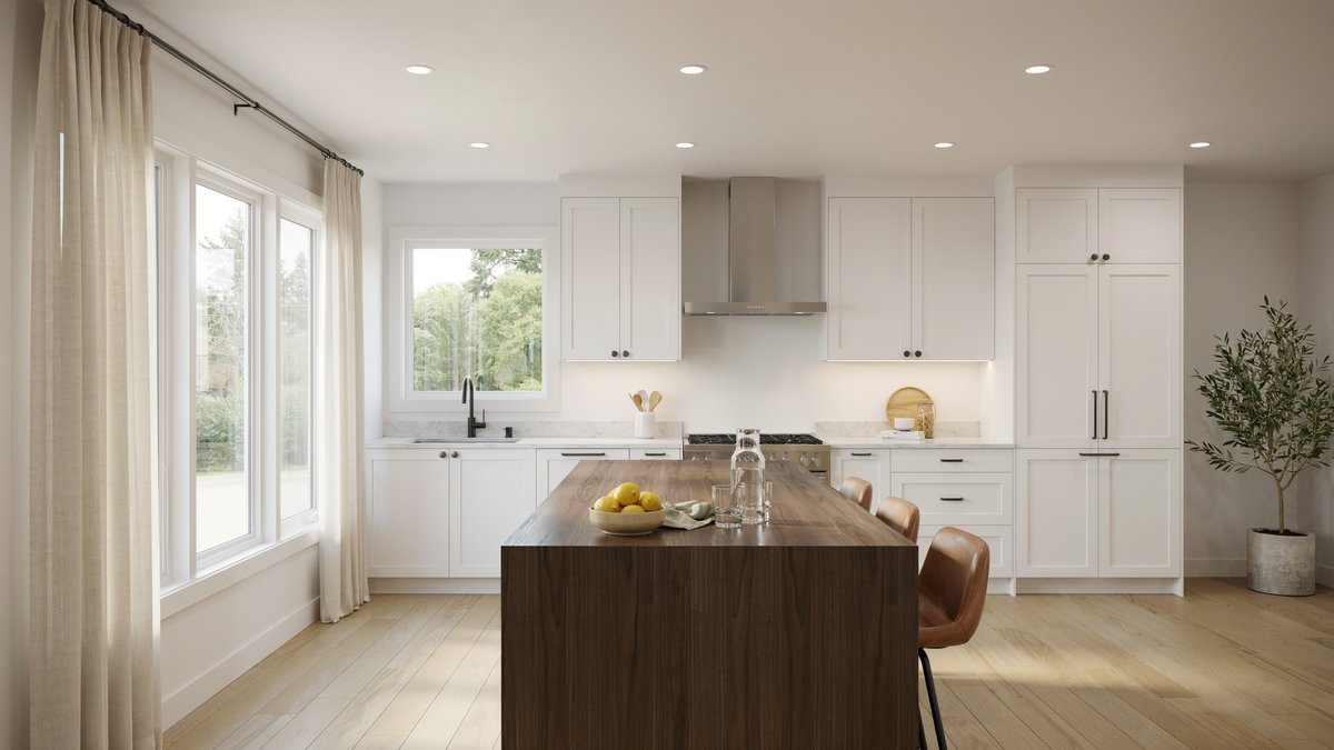 Bright kitchen with white cabinets, quartz counters and a dark wood island