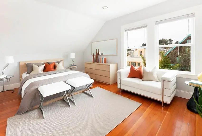 Modern bedroom with cinnamon maple hardwood floor white sofa under window