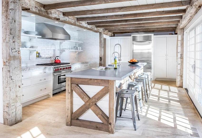 Modern farmhouse kitchen with reclaimed wood beams shiplap island white cabinets wood flooring