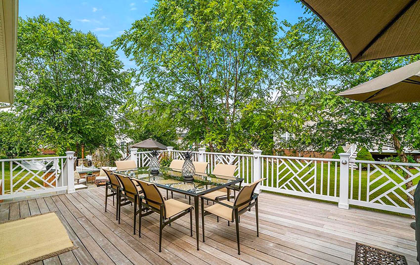 Home with deck and outdoor dining furniture