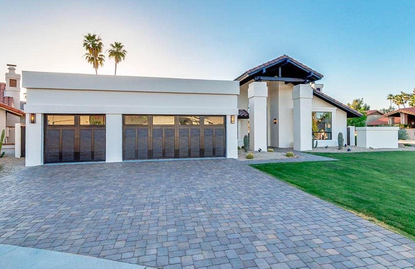 Home with lawn, white walls and driveway