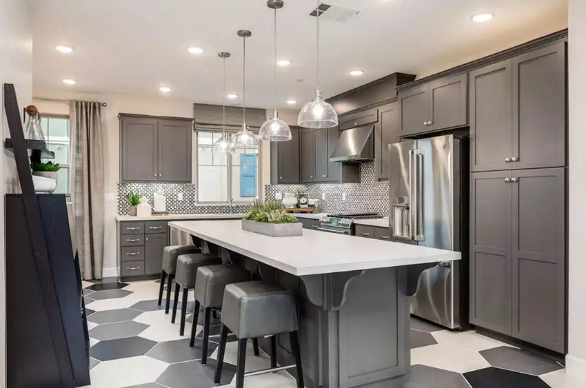 Modern kitchen with dark cabinets hexagon floor tile white quartz countertops