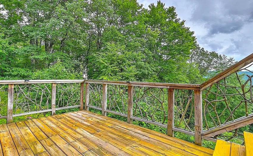 Rustic deck railing with decorative tree branches