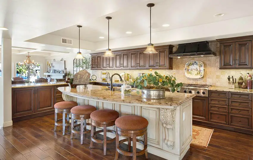 Rustic solid wood kitchen with cream island peninsula and beige granite countertops