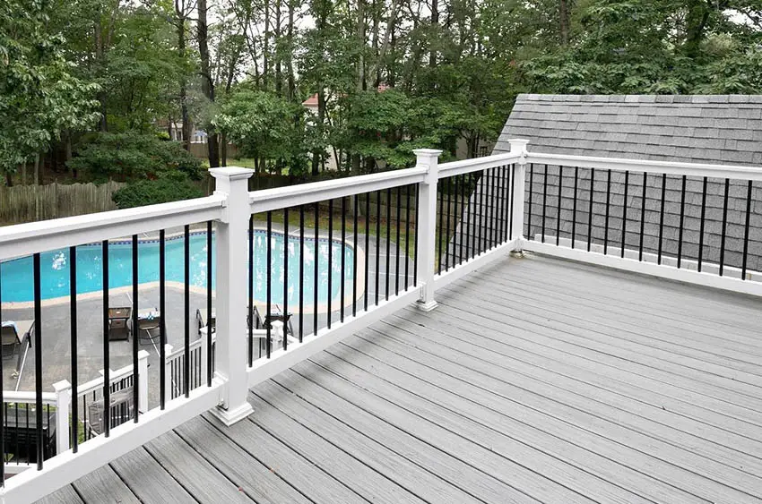 Traditional white vinyl and metal deck railing