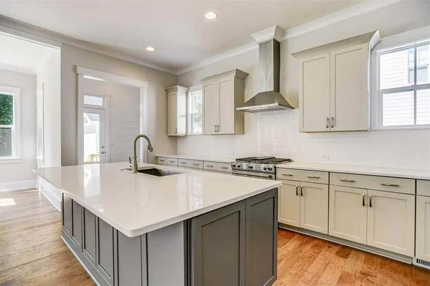 Transitional kitchen with caesarstone countertops dark gray island and light gray cabinets