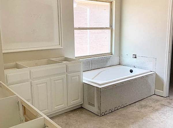 Bathroom under construction with tub