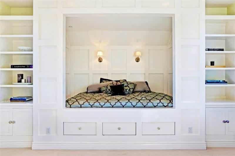 Bedroom with built in bed storage shelving and drawers