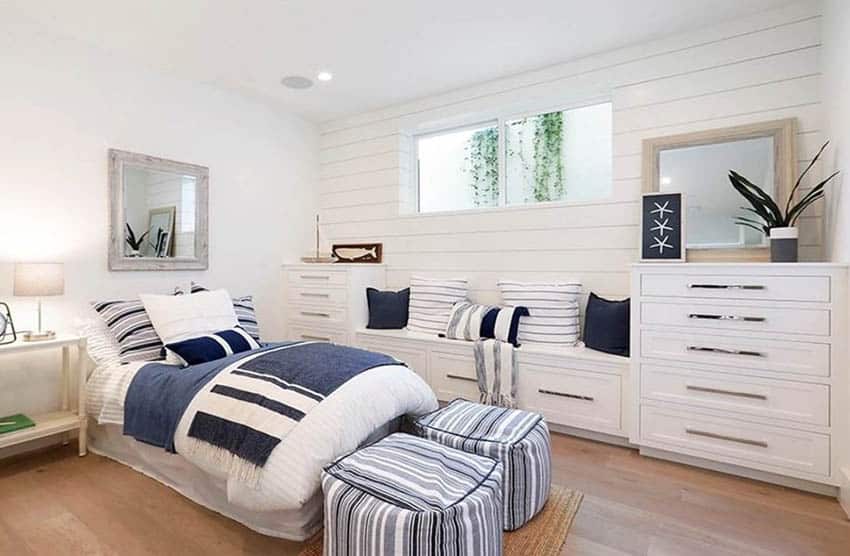 Bedroom with built in storage and bench