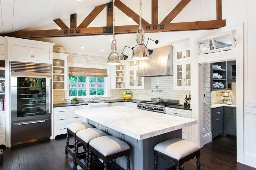 Cape cod kitchen design with white shaker cabinets pendant lights and butlers pantry