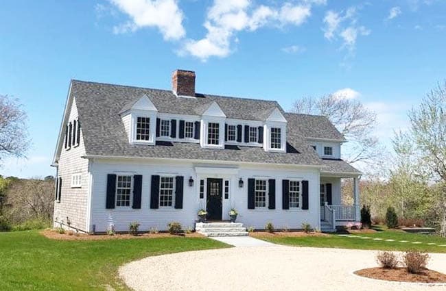 Cape cod style house with circular driveway