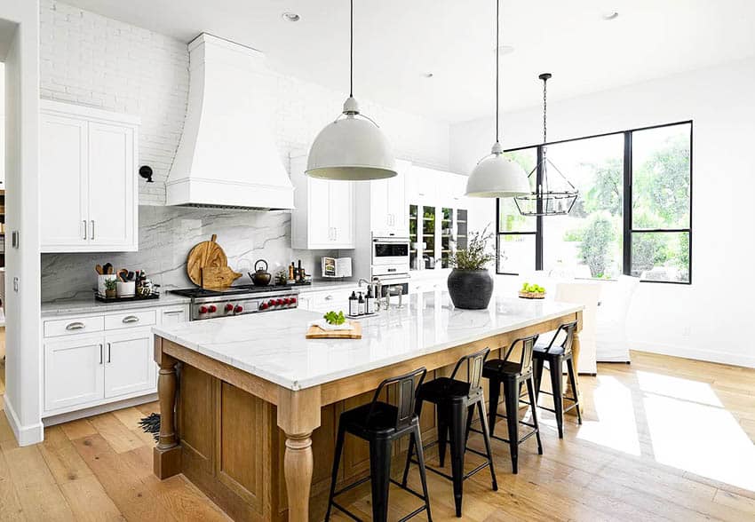 https://designingidea.com/wp-content/uploads/2020/10/chefs-kitchen-with-marble-and-quartz-counters-white-cabinets-pendant-lights-backsplash.jpg