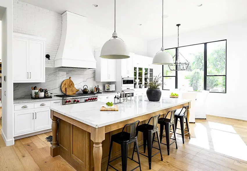 https://designingidea.com/wp-content/uploads/2020/10/chefs-kitchen-with-marble-and-quartz-counters-white-cabinets-pendant-lights-backsplash.jpg.webp