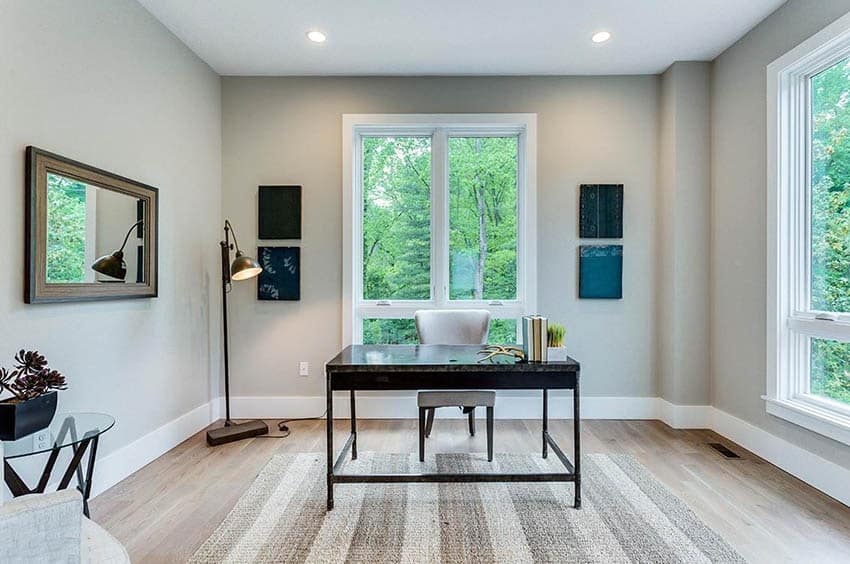 Contemporary home office with wood flooring recessed lighting