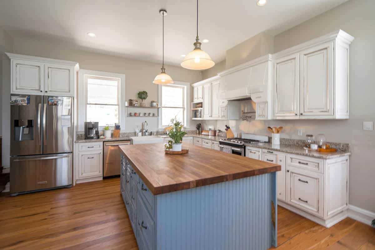 Cottage kitchen with powder blue-painted island