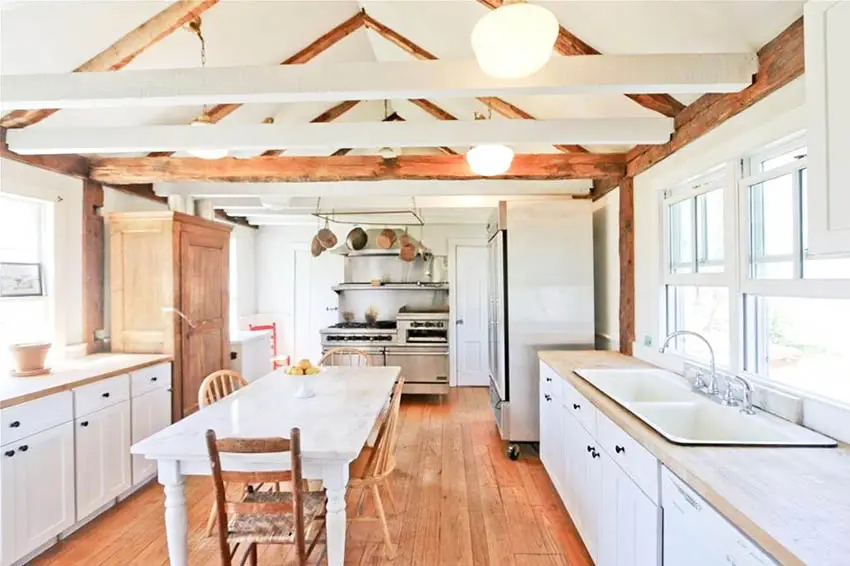 Country kitchen with cathedral ceiling and wood beams