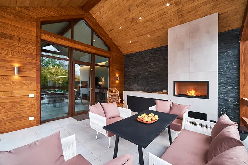 Covered patio with fireplace and glass screen 
