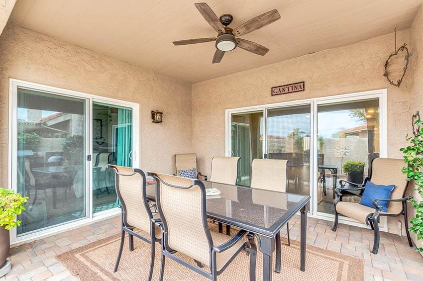 Covered stucco and paver patio