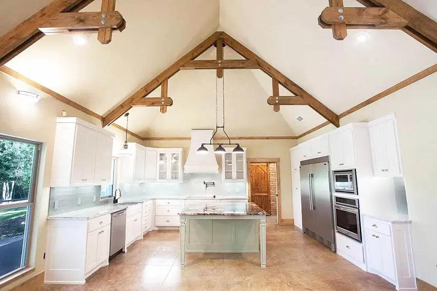 Kitchen with cathedral ceiling white cabinets