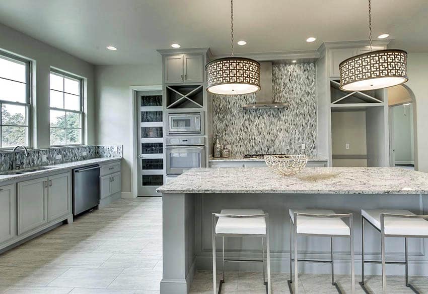 Kitchen with light gray cabinets light green paint white granite countertops
