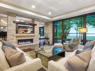 Luxury living room with gas fireplace and stone pillars