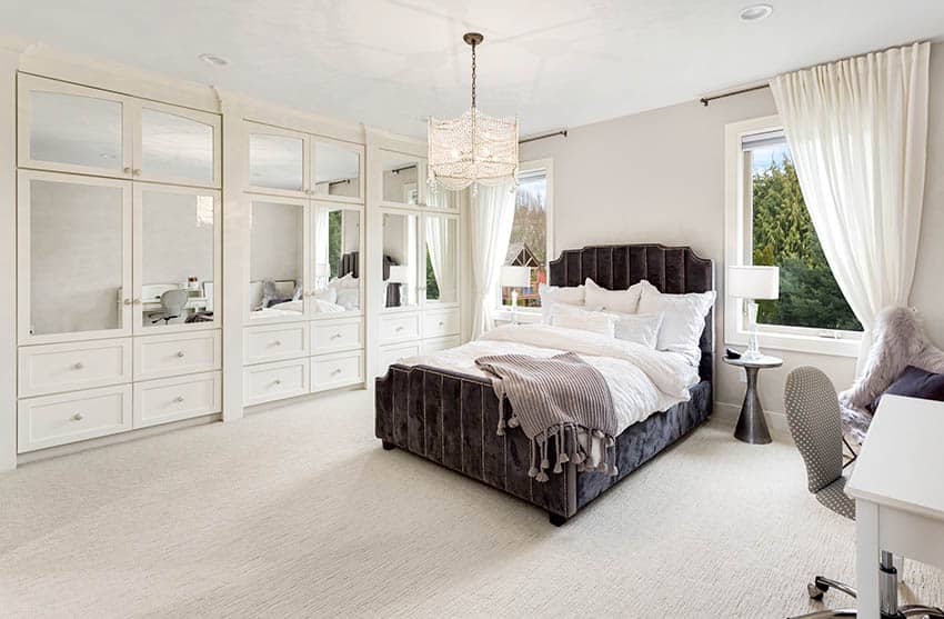 Master bedroom with built-in wardrobe with cabinets and drawers