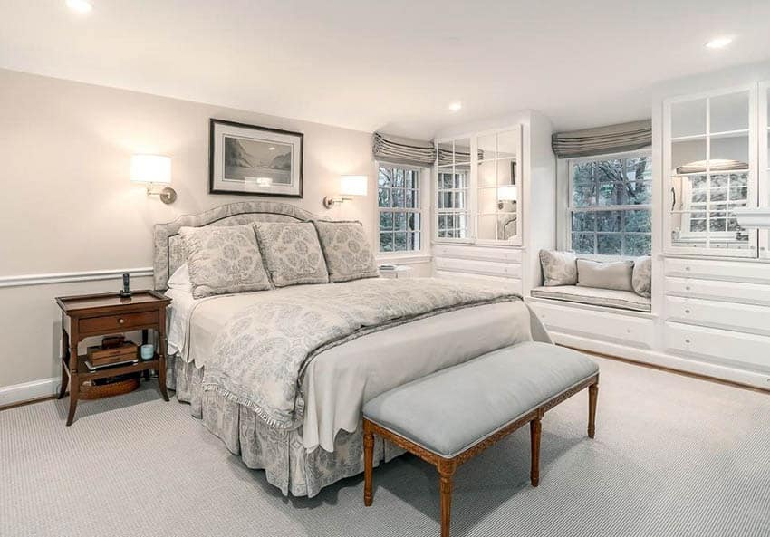 Master bedroom with custom built in cabinets and window seat