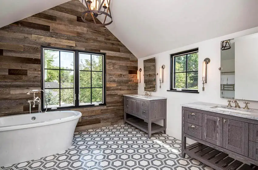 Bathroom with rustic chandelier, doube vanity tables with mirrors and bathtub