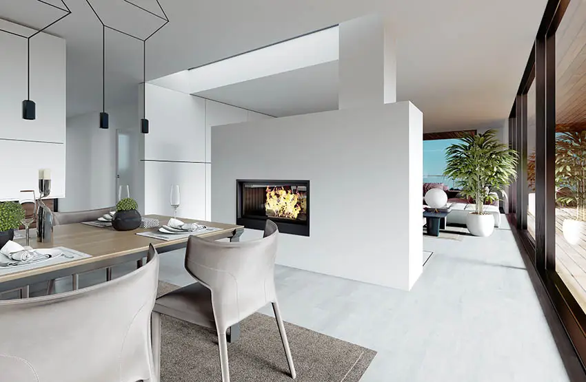 Double-sided fireplace between the dining room and living room