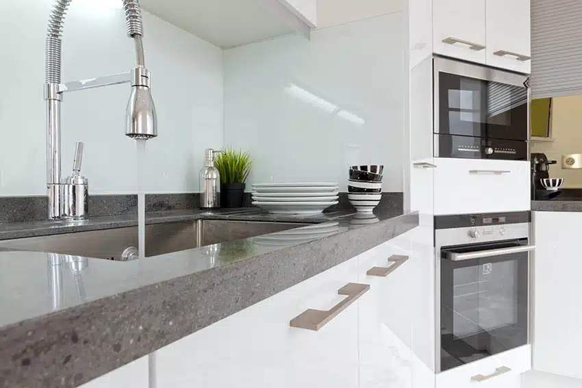 Modern kitchen with gray recycled glass countertops