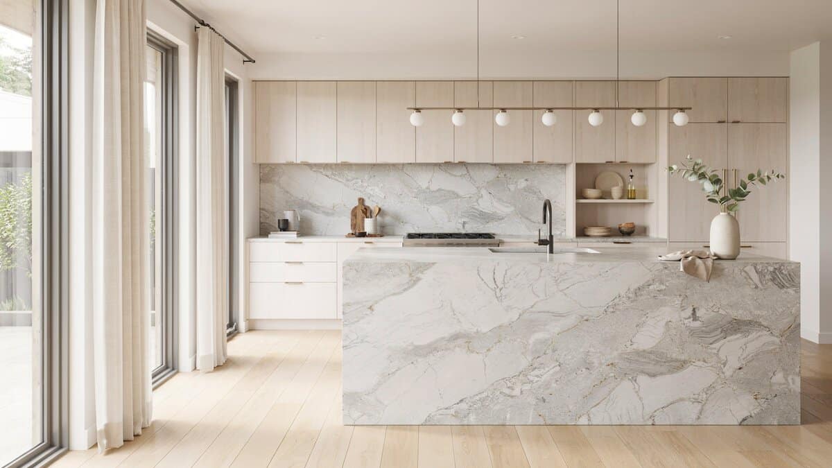 Waterfall quartzite island in a modern kitchen with bleached wood cabinetry